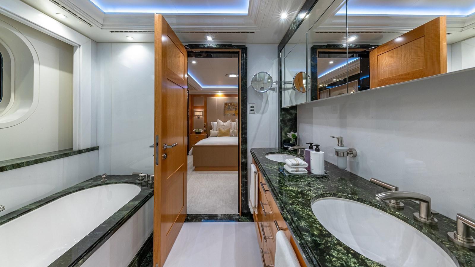 a bathroom with a sink and a bathtub aboard MARGUERITE Yacht for Charter