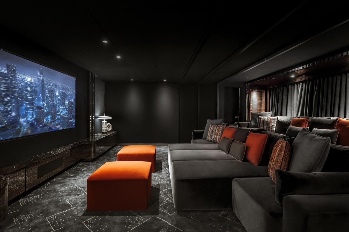 a living room with a large screen aboard VICTORIOUS Yacht for Charter