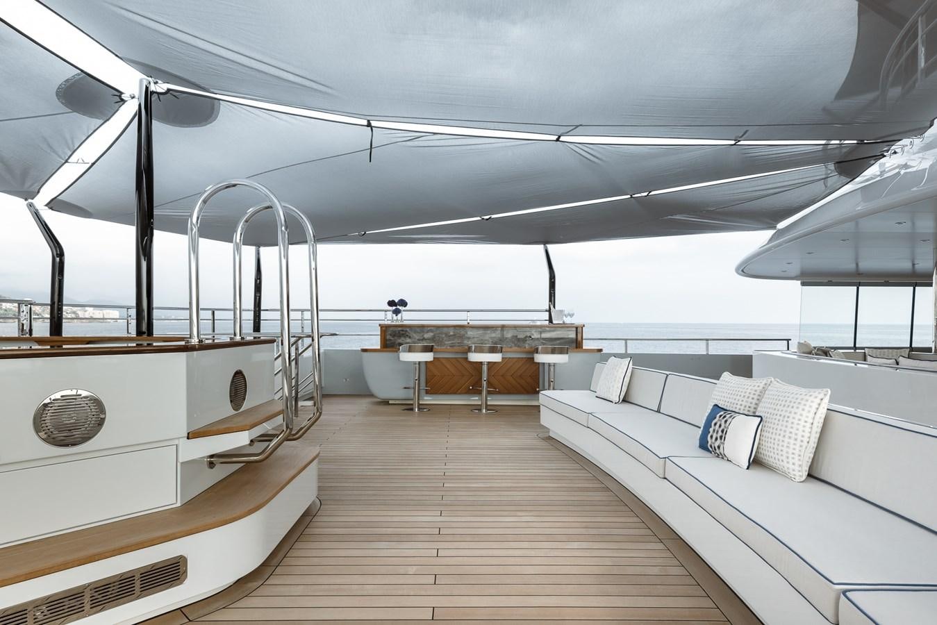 a room with a couch and a table aboard VICTORIOUS Yacht for Charter