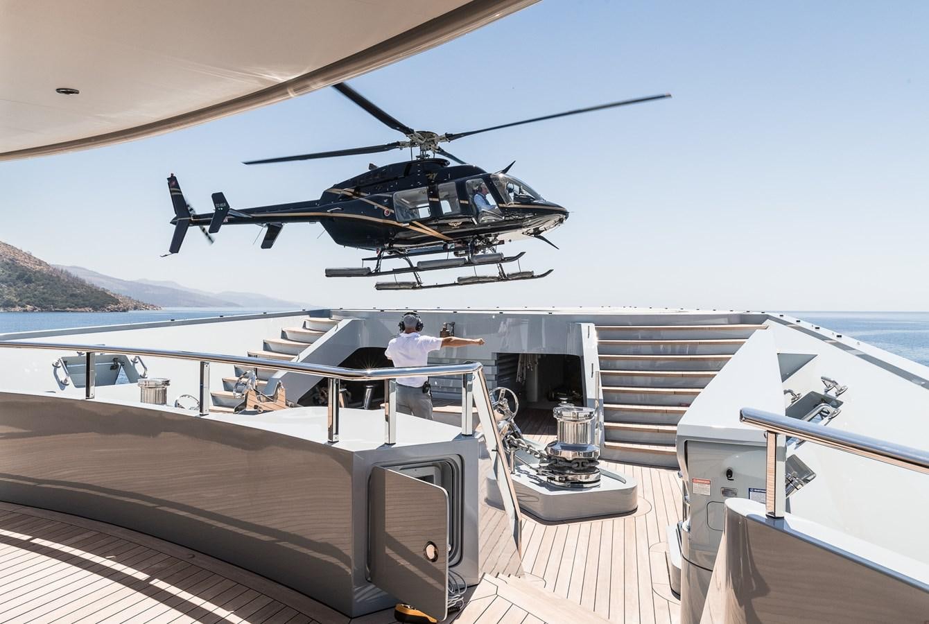 a helicopter on a deck aboard VICTORIOUS Yacht for Charter