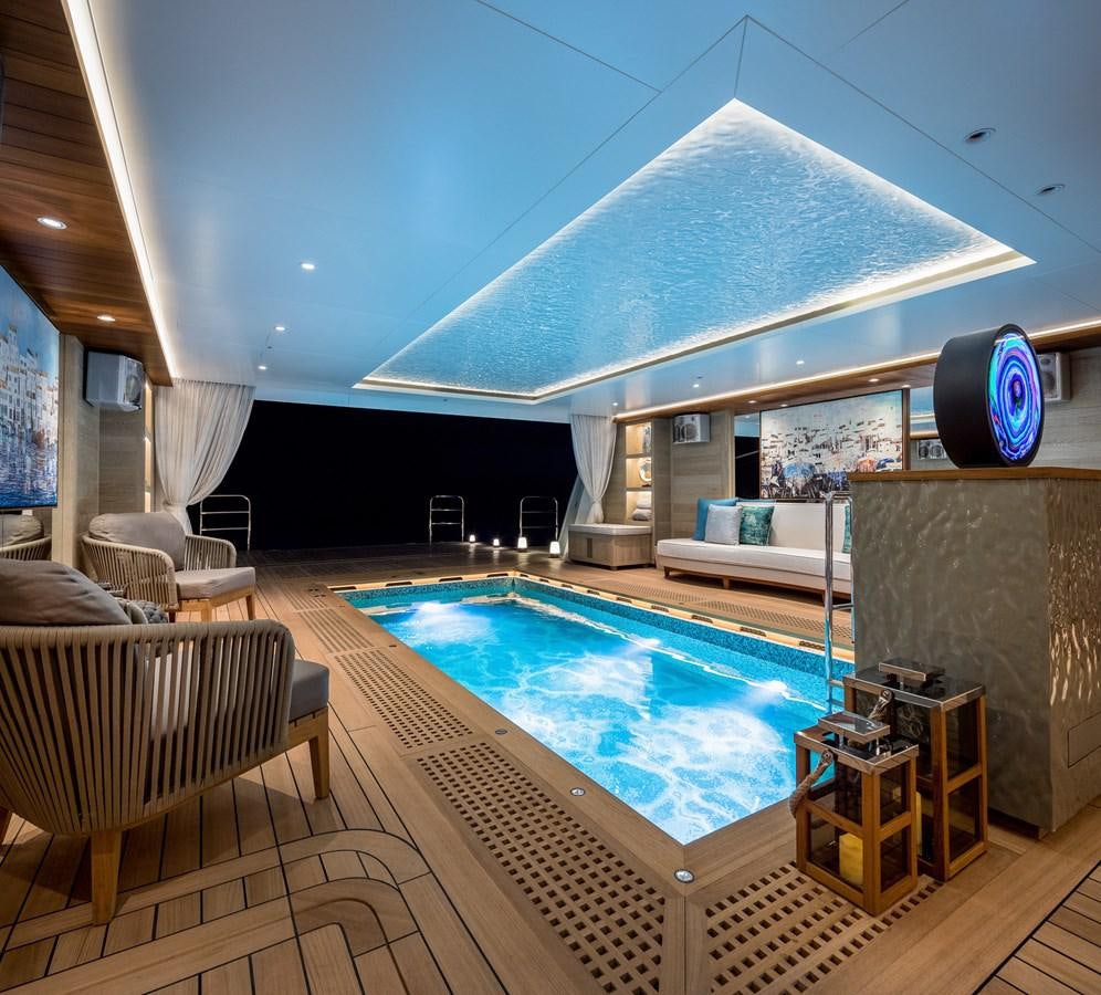 a large indoor swimming pool aboard VICTORIOUS Yacht for Charter