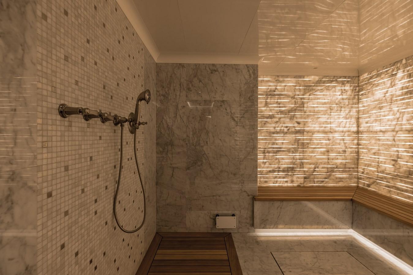 a room with a shower and a sink aboard VICTORIOUS Yacht for Charter