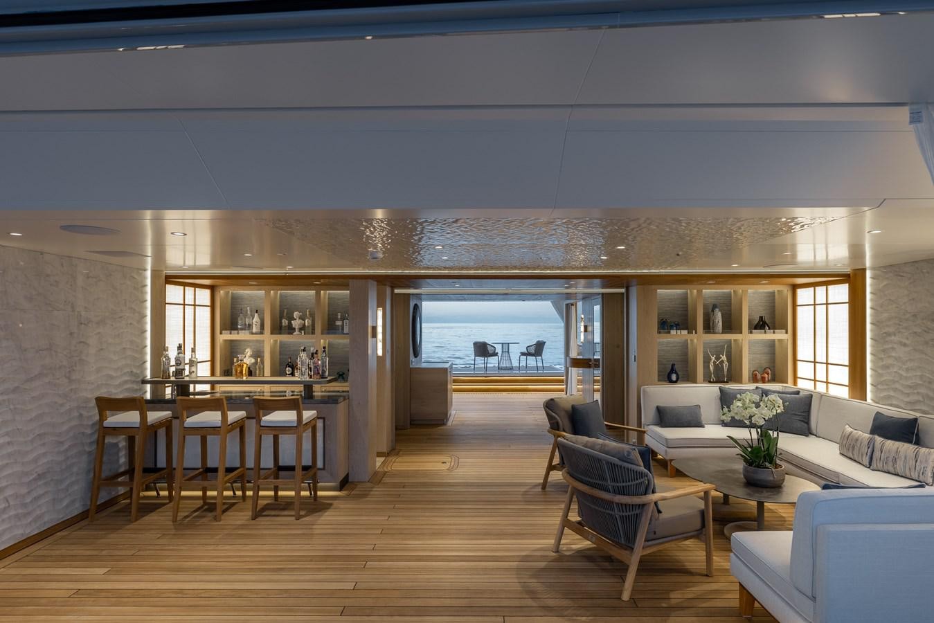 a living room with a wood floor aboard VICTORIOUS Yacht for Charter
