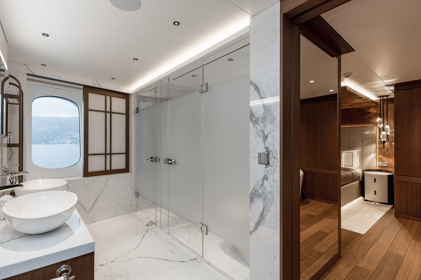 a bathroom with a glass shower aboard VICTORIOUS Yacht for Charter