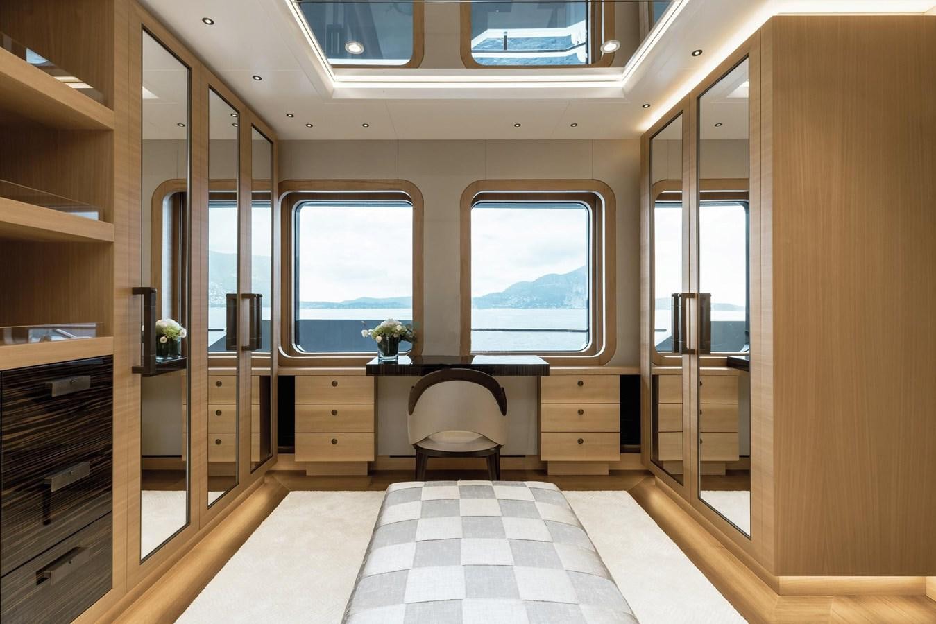 a room with a chair and a desk aboard VICTORIOUS Yacht for Charter