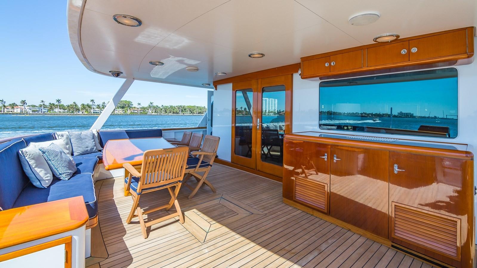a room with a couch and a television aboard CASUAL WATER Yacht for Sale