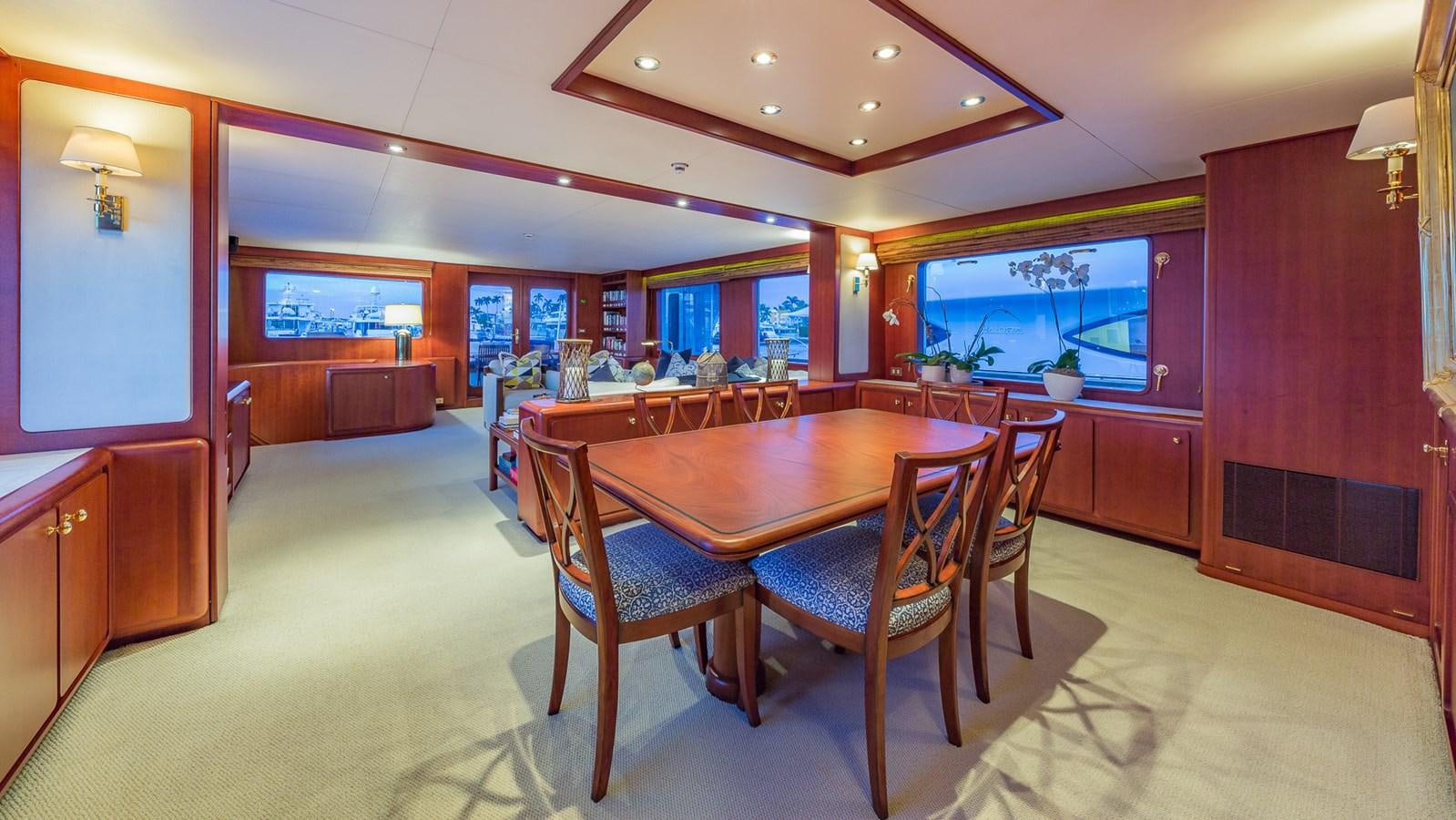 a dining room with a table and chairs aboard CASUAL WATER Yacht for Sale
