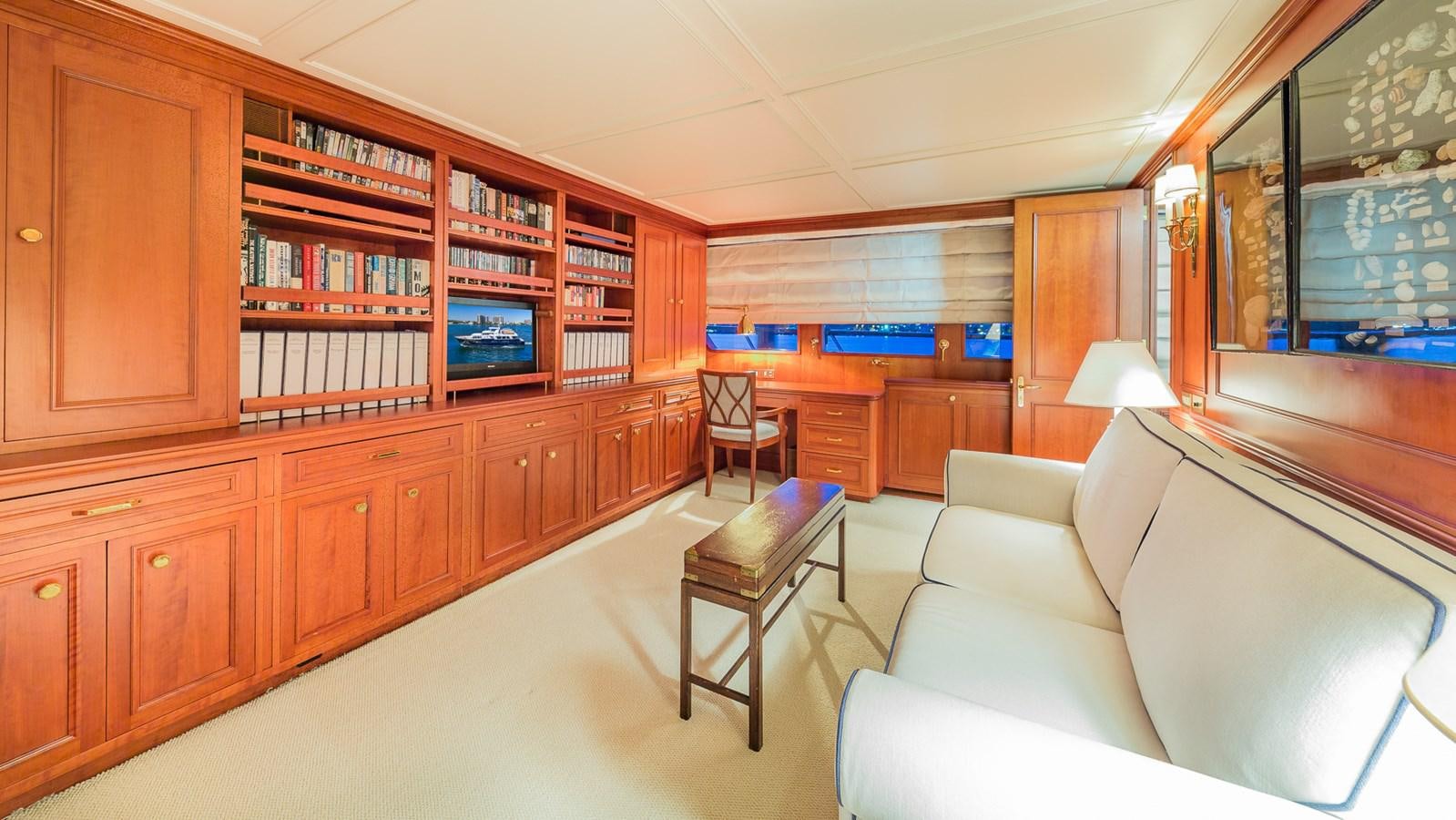 a living room with a couch and a coffee table aboard CASUAL WATER Yacht for Sale