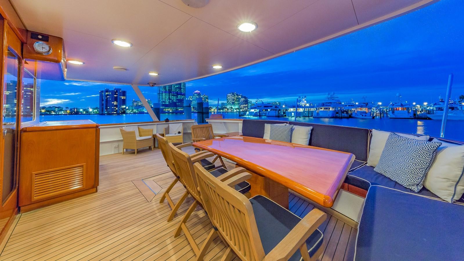a room with a table and chairs aboard CASUAL WATER Yacht for Sale