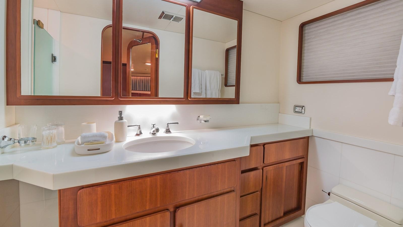 a bathroom with a large mirror aboard CASUAL WATER Yacht for Sale