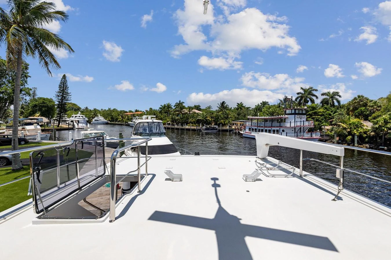 a swimming pool with a deck and a view of the water and trees aboard JEF82110L506 Yacht for Sale