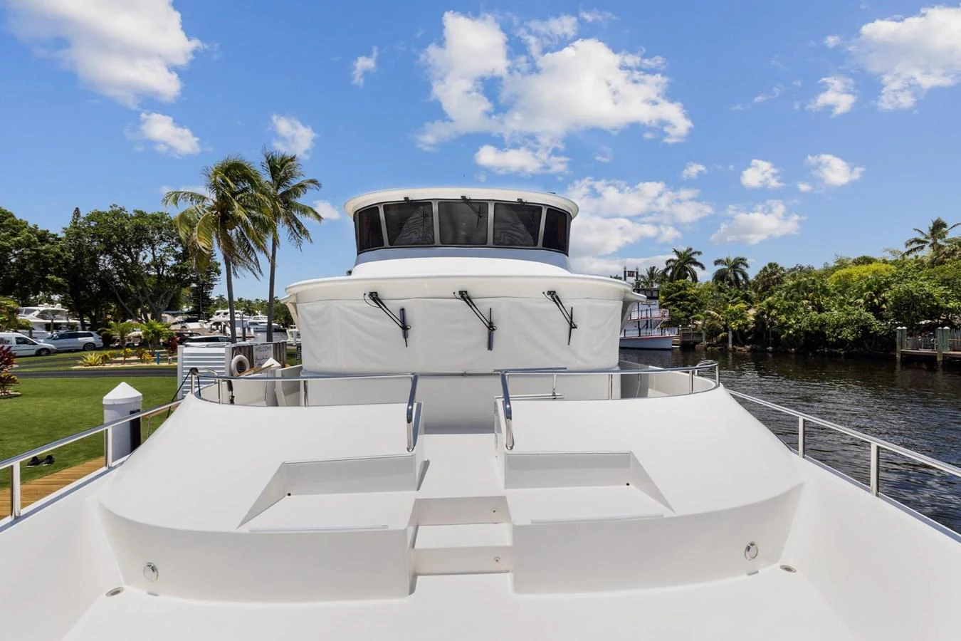 a white boat on a dock aboard JEF82110L506 Yacht for Sale