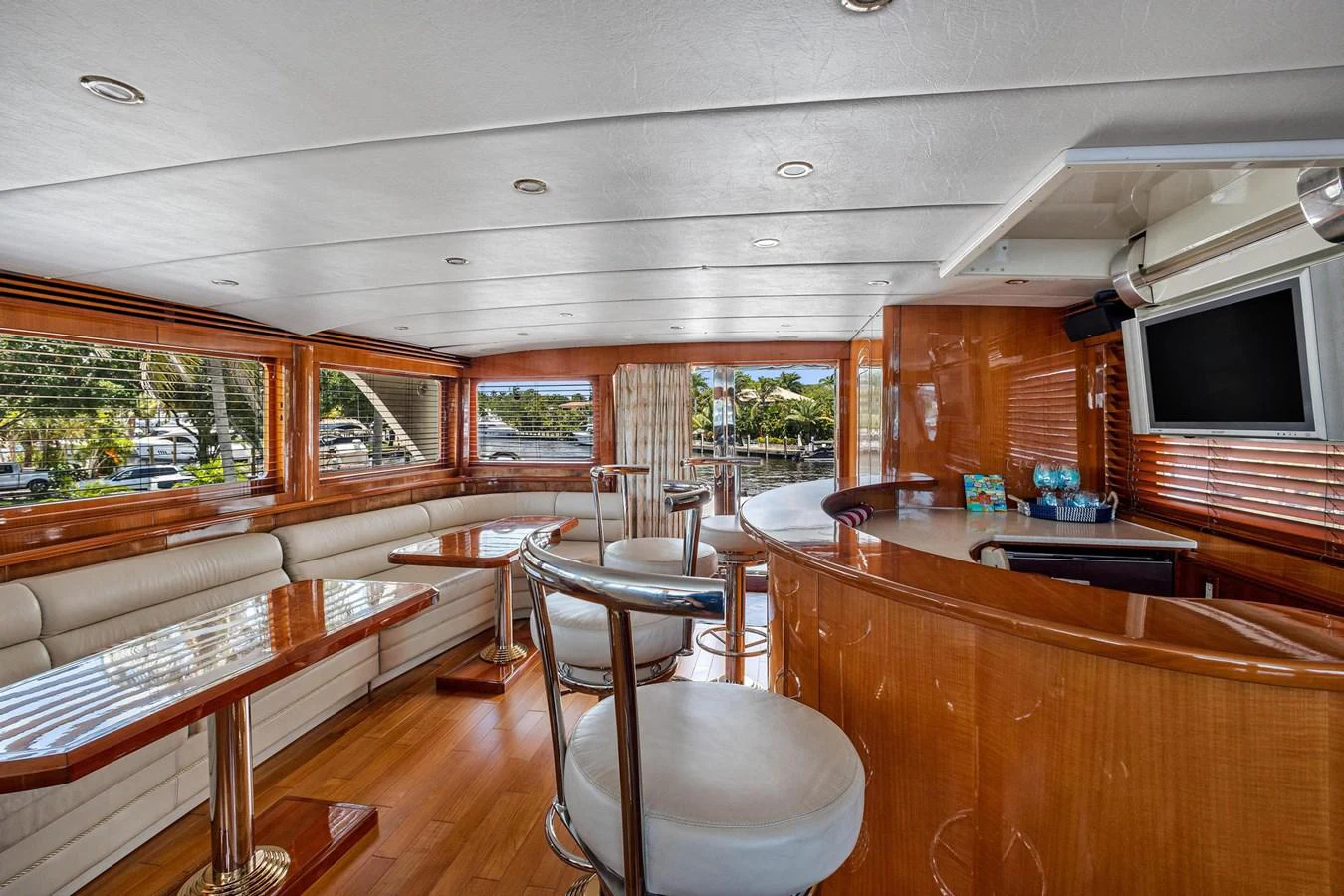 a room with wood furniture and a tv on the wall aboard JEF82110L506 Yacht for Sale