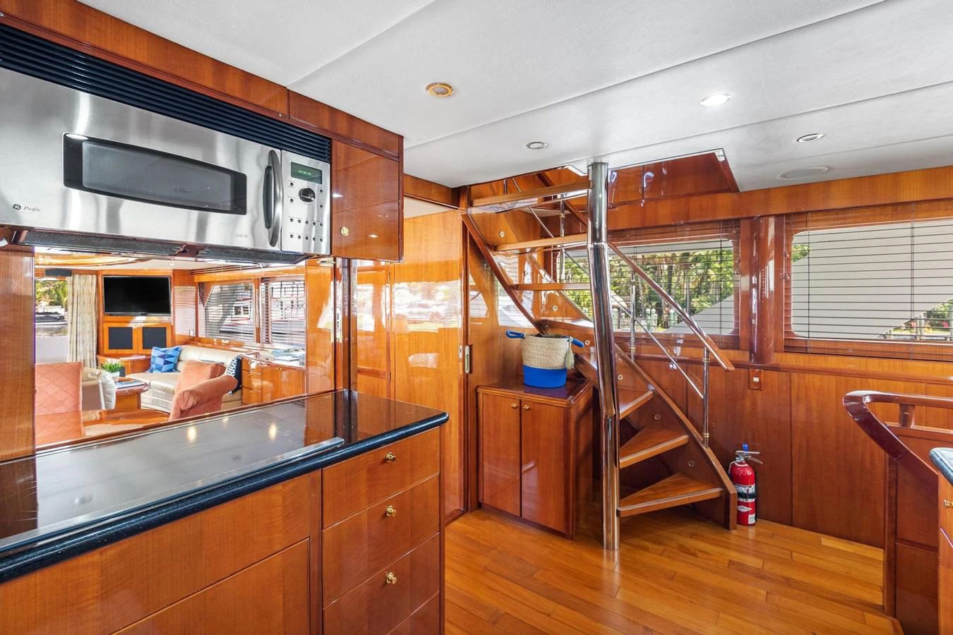 a kitchen with wooden cabinets aboard JEF82110L506 Yacht for Sale