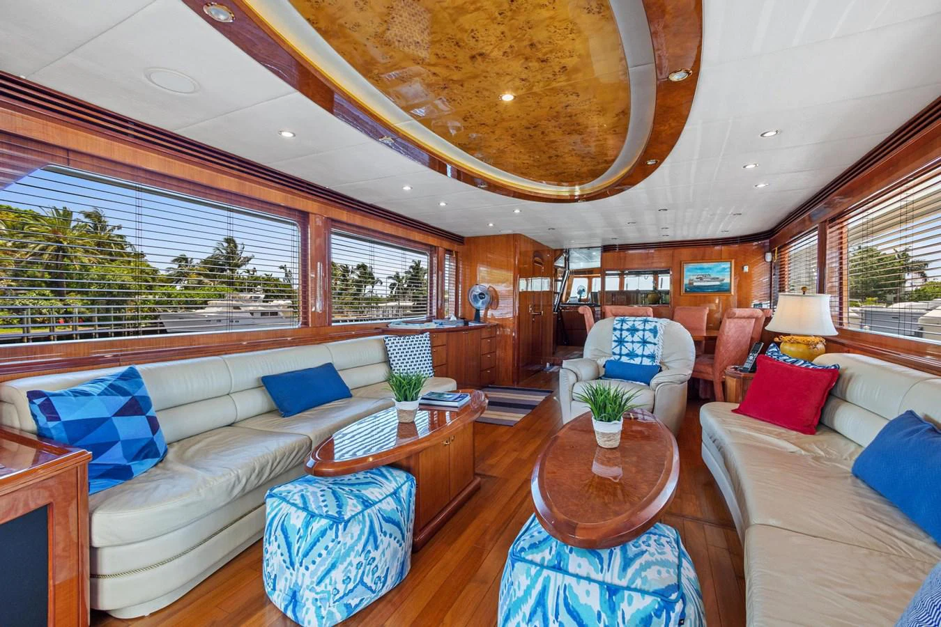 a living room with a large chandelier aboard JEF82110L506 Yacht for Sale