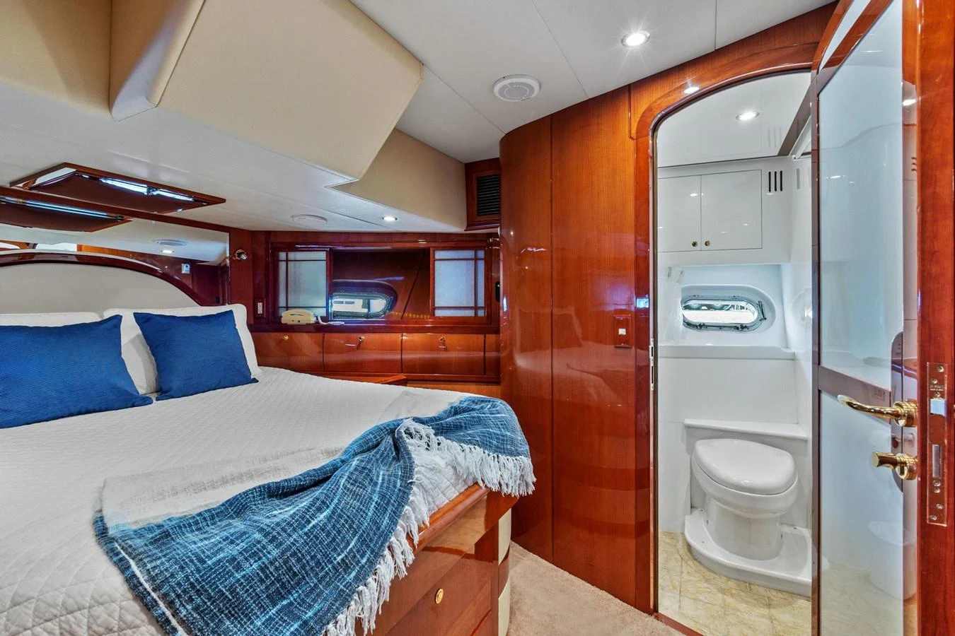 a bedroom with a bed and a closet aboard JEF82110L506 Yacht for Sale