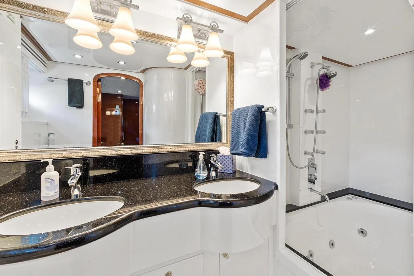 a bathroom with a large mirror aboard JEF82110L506 Yacht for Sale