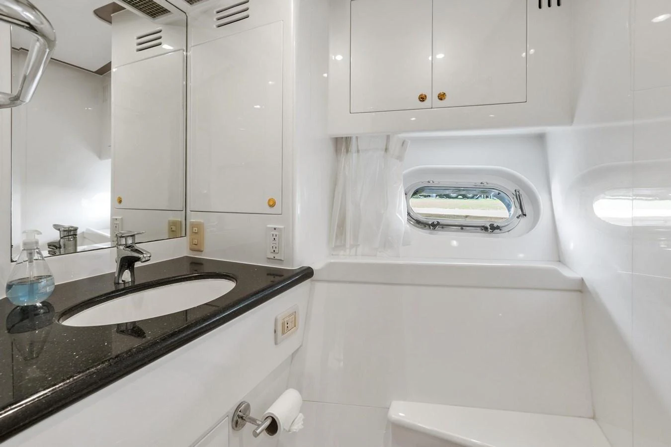 a bathroom with a sink and a mirror aboard JEF82110L506 Yacht for Sale