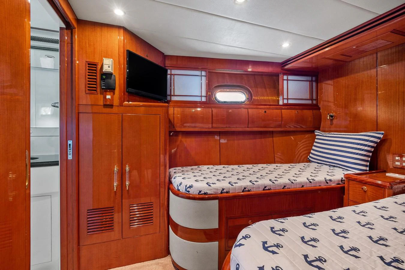 a cabin with a bed and a table aboard JEF82110L506 Yacht for Sale
