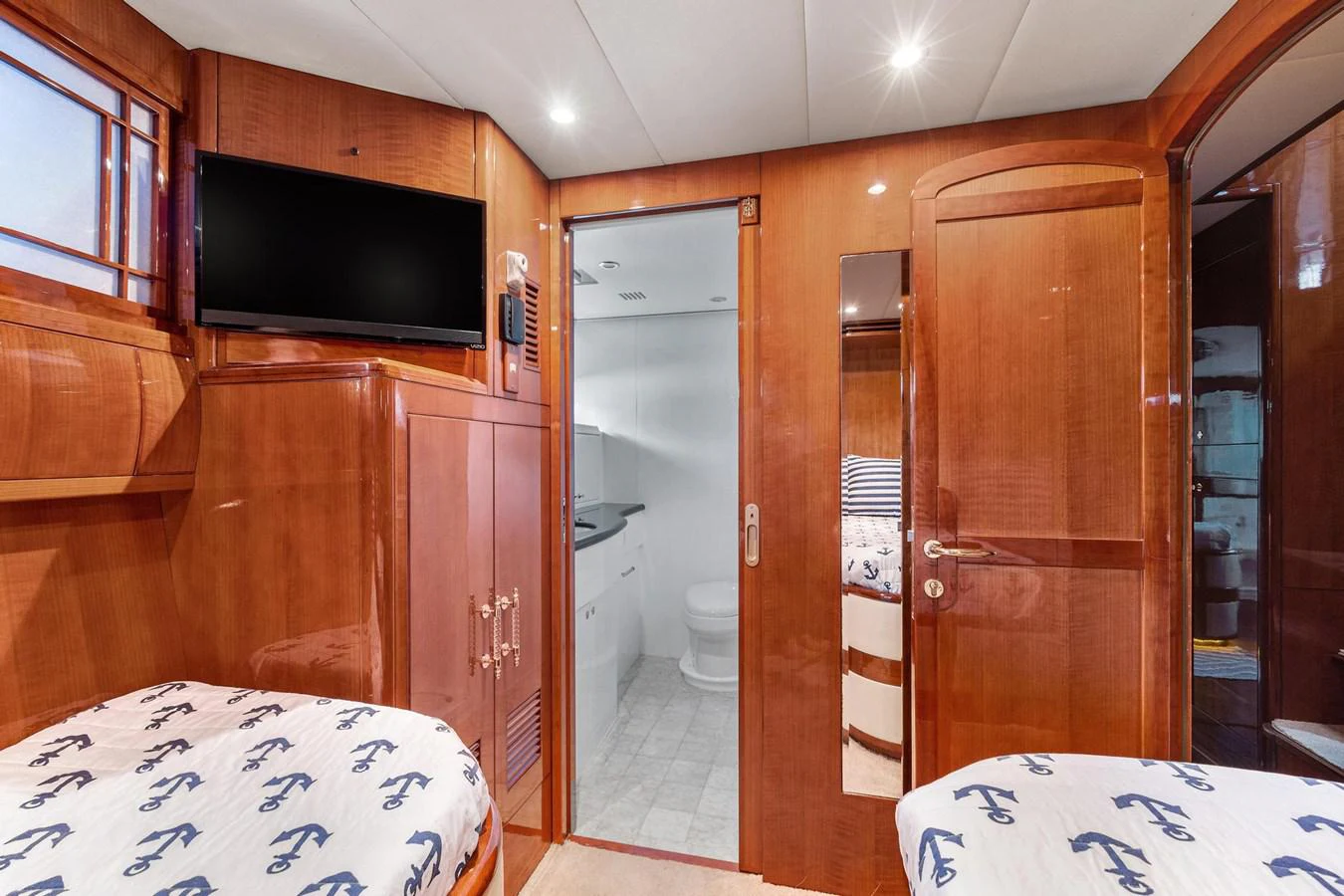 a bedroom with a bed and a television aboard JEF82110L506 Yacht for Sale