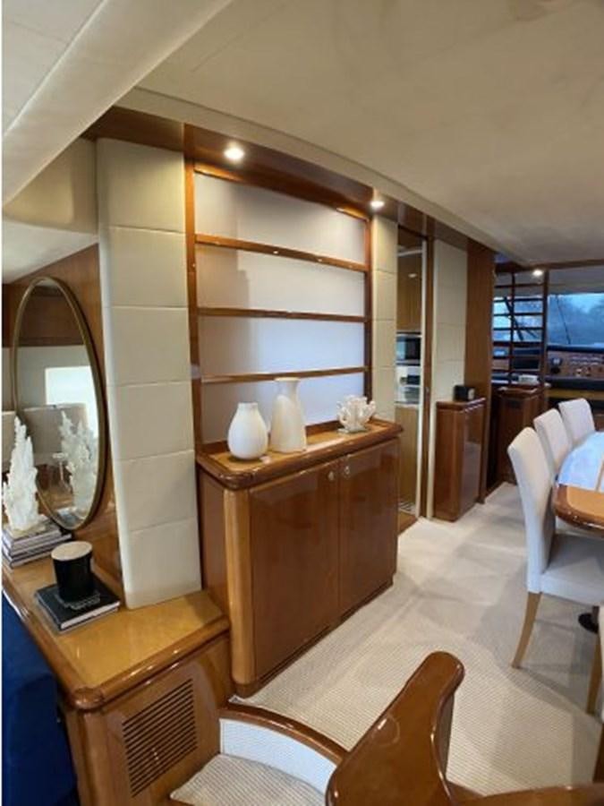 a wood cabinet in a room aboard 2005 760 FERRETTI MOTOR YACHT Yacht for Sale