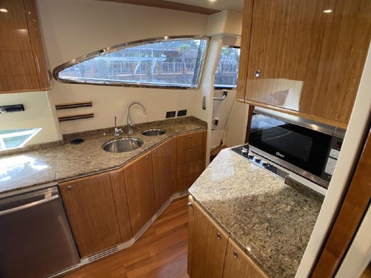 a kitchen with granite counter tops aboard 2005 760 FERRETTI MOTOR YACHT Yacht for Sale