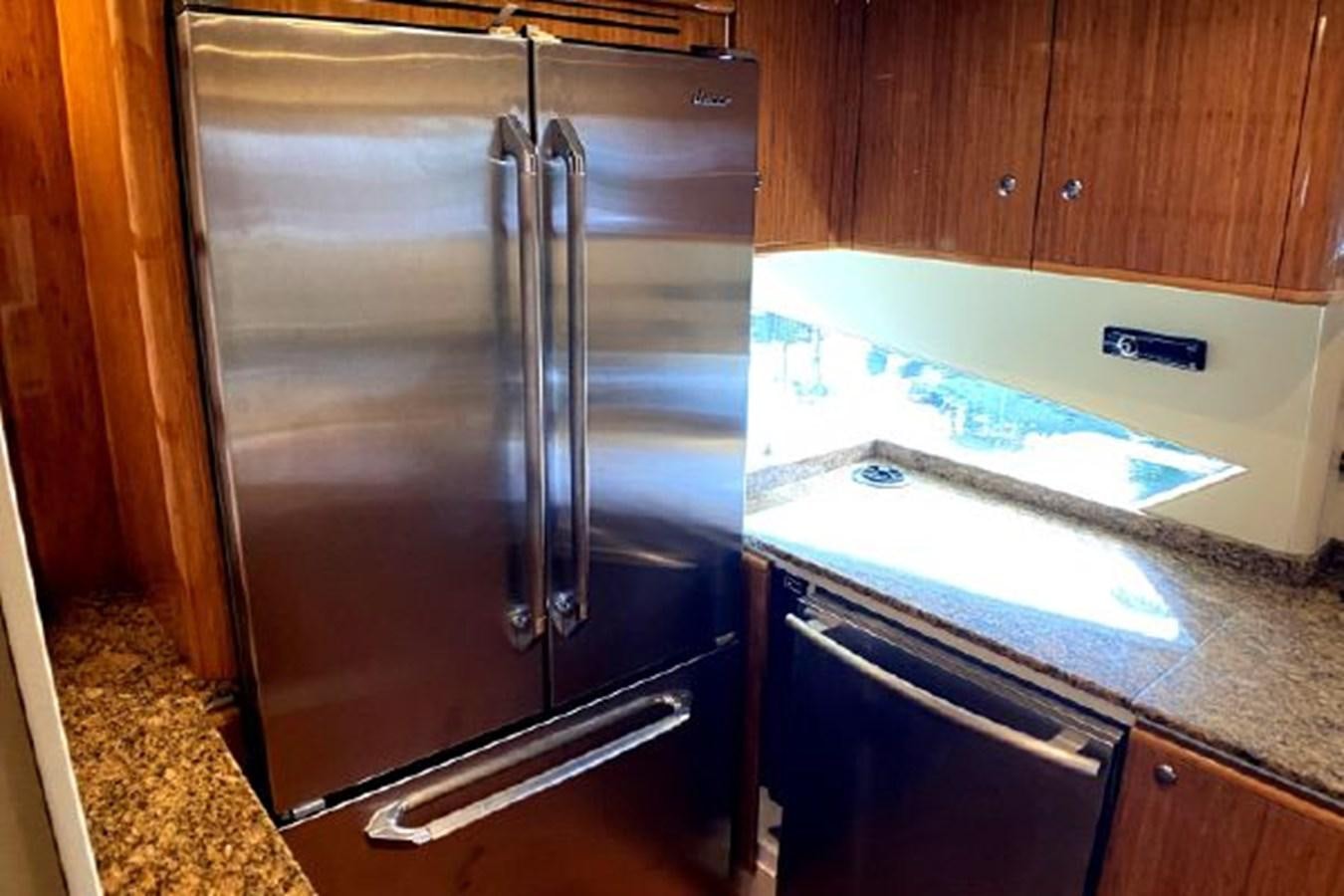 a stainless steel refrigerator in a kitchen aboard 2005 760 FERRETTI MOTOR YACHT Yacht for Sale