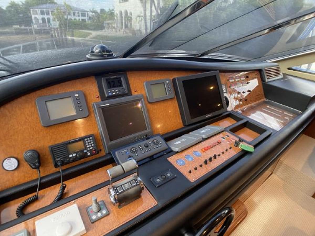 a wooden radio with a radio and other electronics on it aboard 2005 760 FERRETTI MOTOR YACHT Yacht for Sale