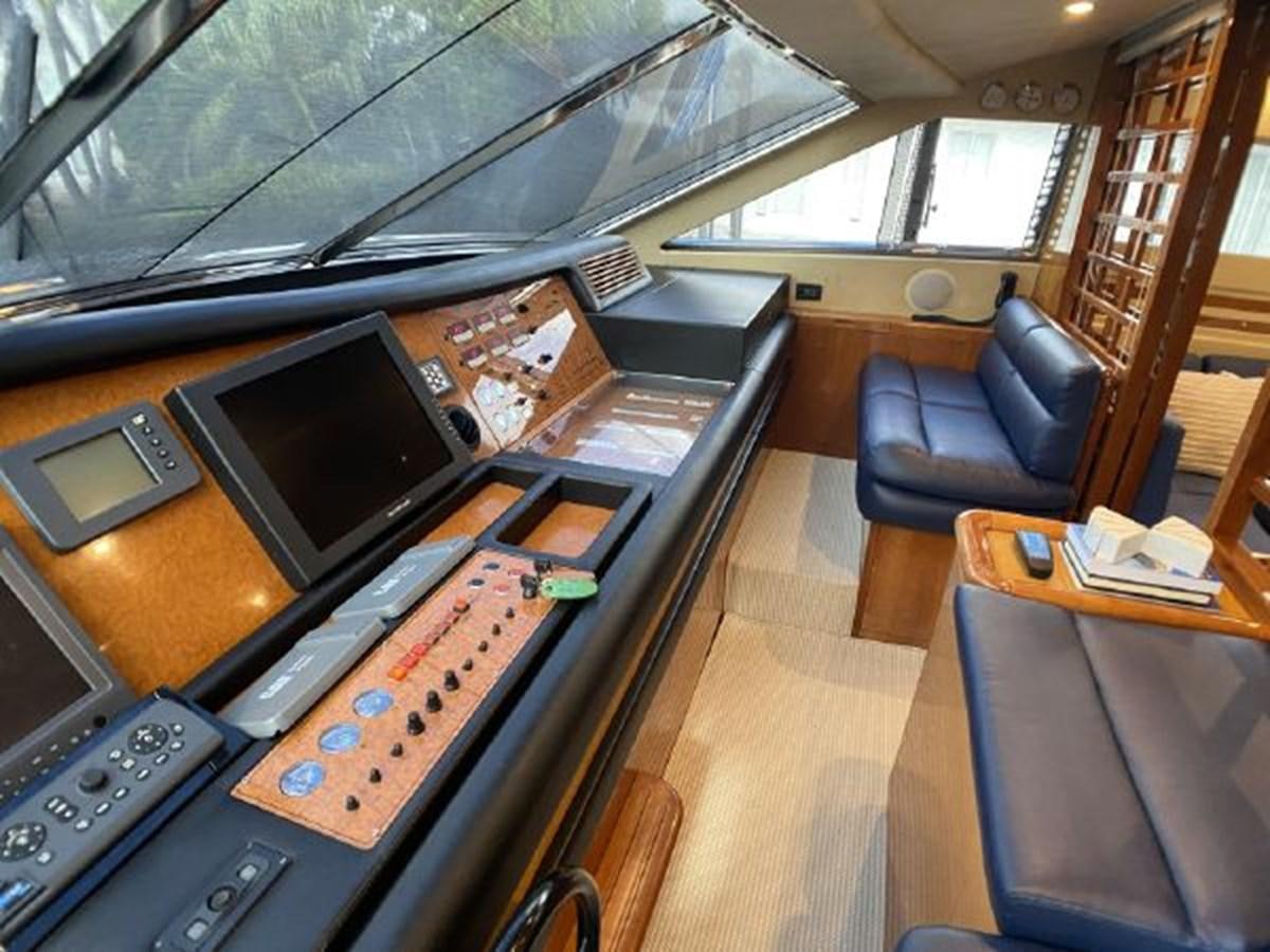 a room with a desk and a television aboard 2005 760 FERRETTI MOTOR YACHT Yacht for Sale