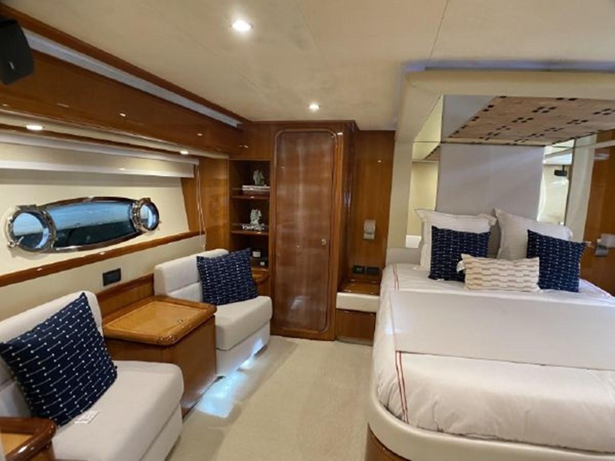 a room with a bed and a car in it aboard 2005 760 FERRETTI MOTOR YACHT Yacht for Sale