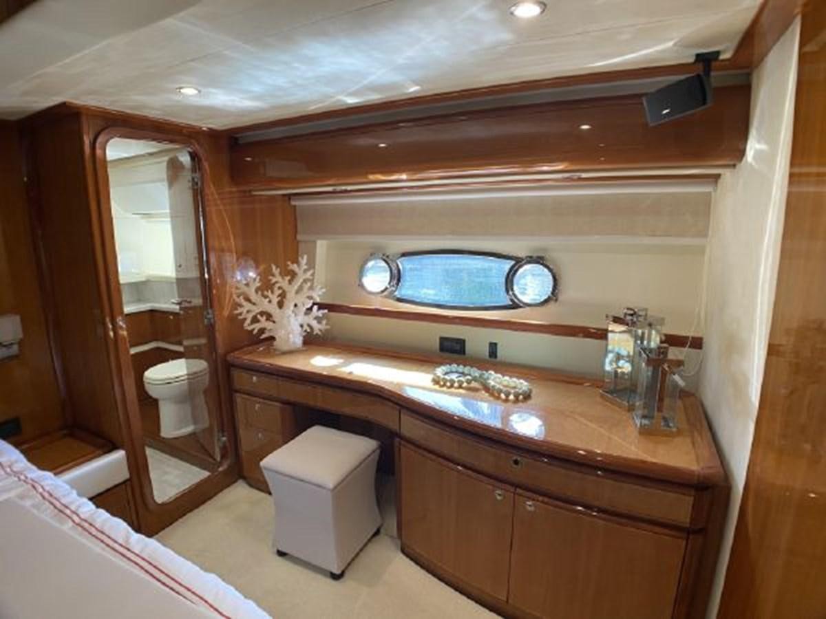 a bathroom with a sink and a mirror aboard 2005 760 FERRETTI MOTOR YACHT Yacht for Sale