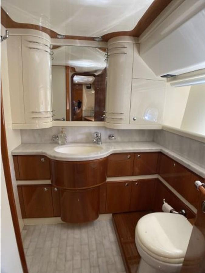 a bathroom with a sink and a toilet aboard 2005 760 FERRETTI MOTOR YACHT Yacht for Sale