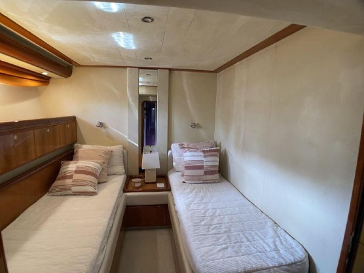 a room with two beds aboard 2005 760 FERRETTI MOTOR YACHT Yacht for Sale