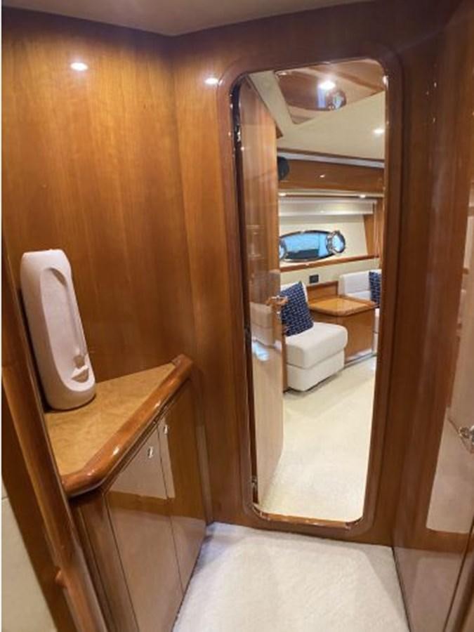 a bathroom with a mirror and a sink aboard 2005 760 FERRETTI MOTOR YACHT Yacht for Sale