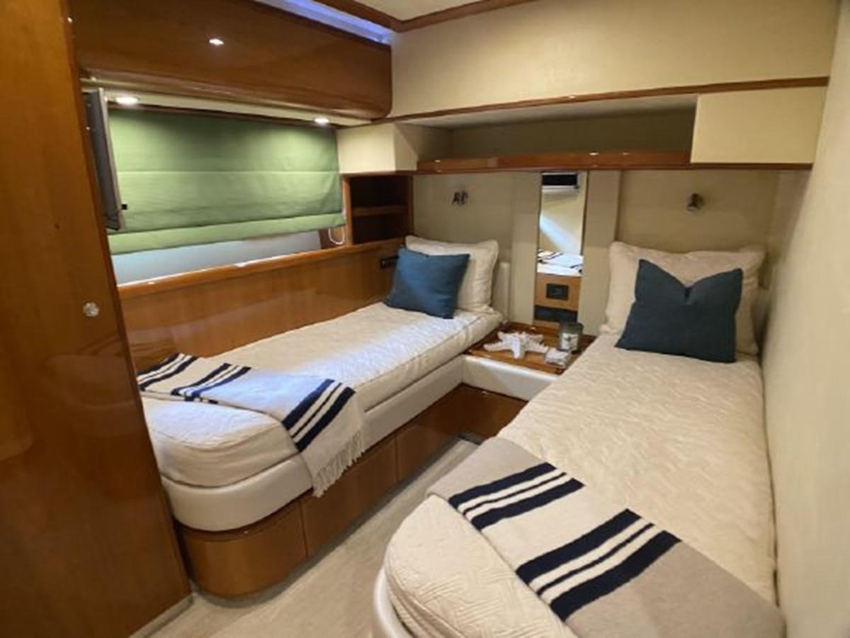 a room with two beds aboard 2005 760 FERRETTI MOTOR YACHT Yacht for Sale