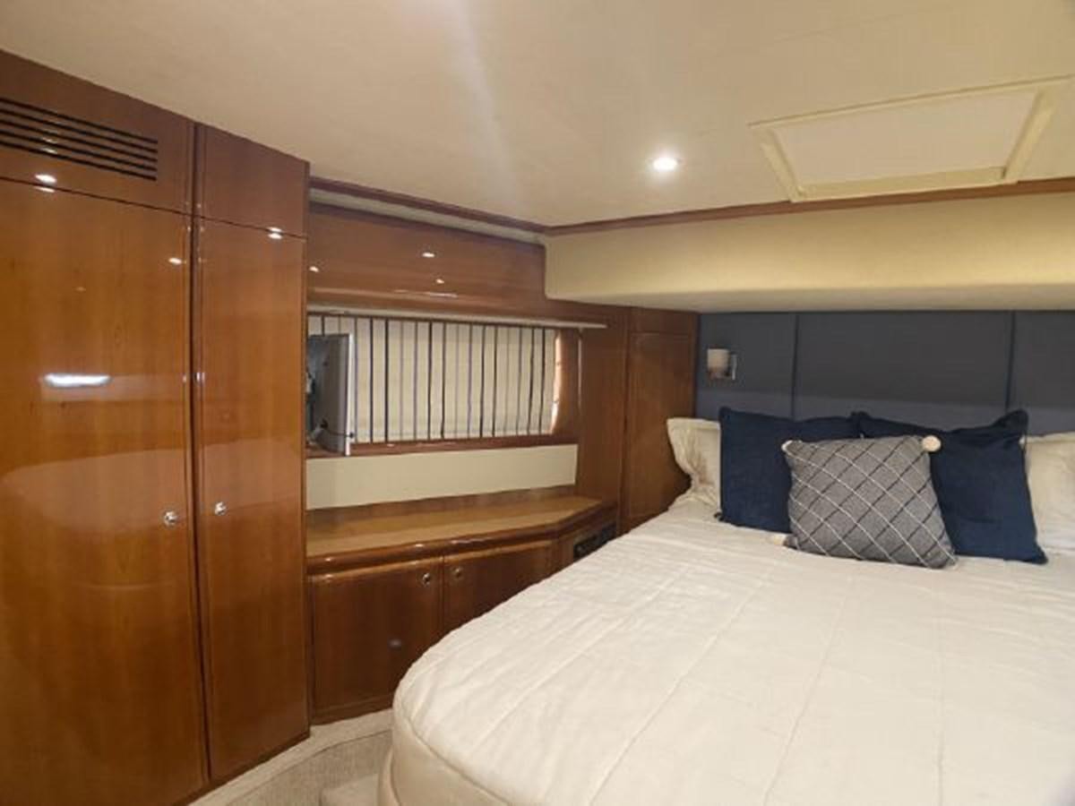 a bed in a room aboard 2005 760 FERRETTI MOTOR YACHT Yacht for Sale