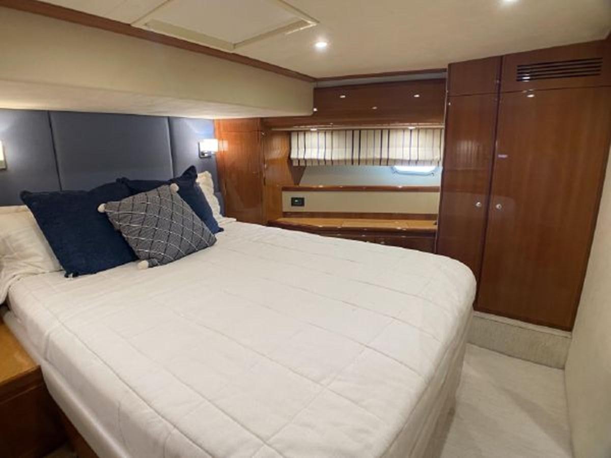 a bed in a room aboard 2005 760 FERRETTI MOTOR YACHT Yacht for Sale