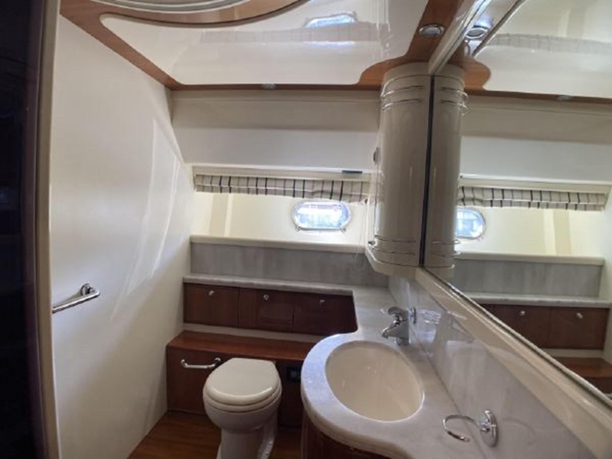 a bathroom with a toilet sink and a bathtub aboard 2005 760 FERRETTI MOTOR YACHT Yacht for Sale