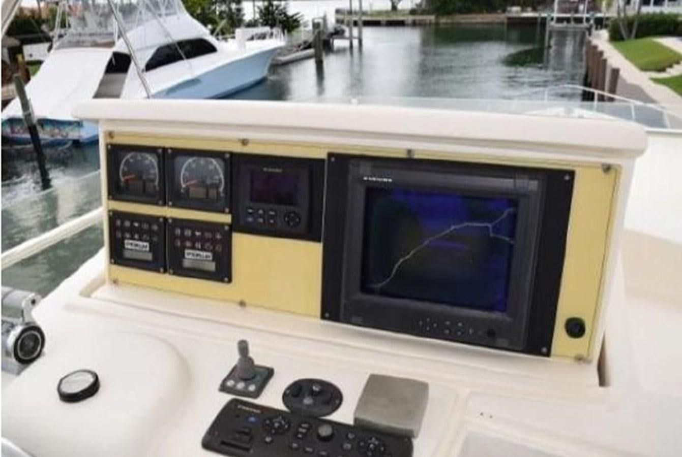 a tv on a table aboard 2005 760 FERRETTI MOTOR YACHT Yacht for Sale