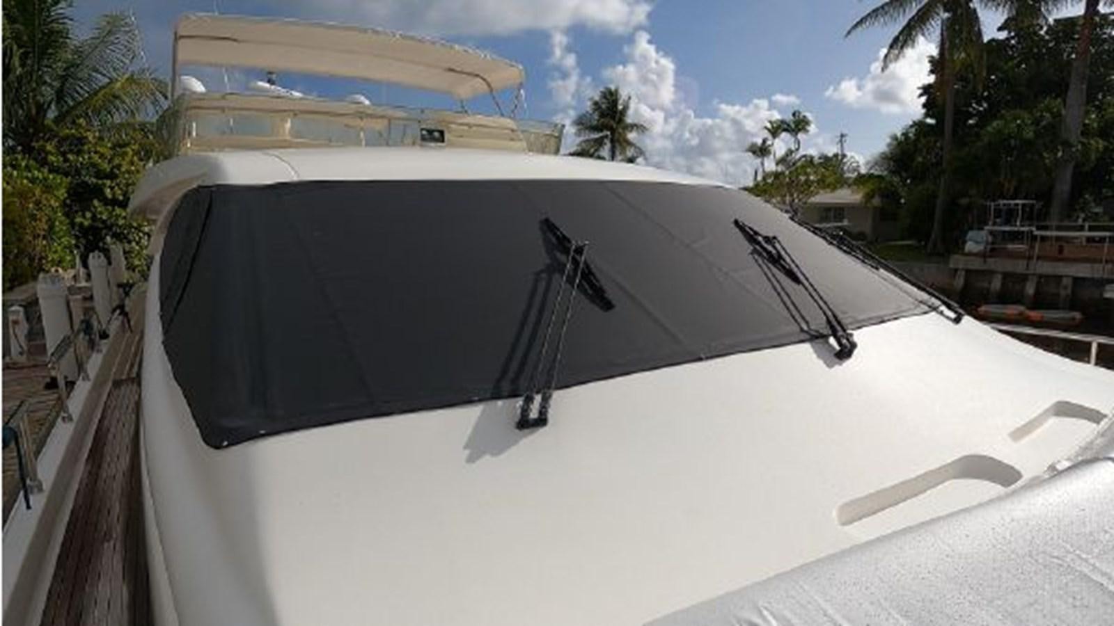 a white boat with a black and white roof aboard 2005 760 FERRETTI MOTOR YACHT Yacht for Sale