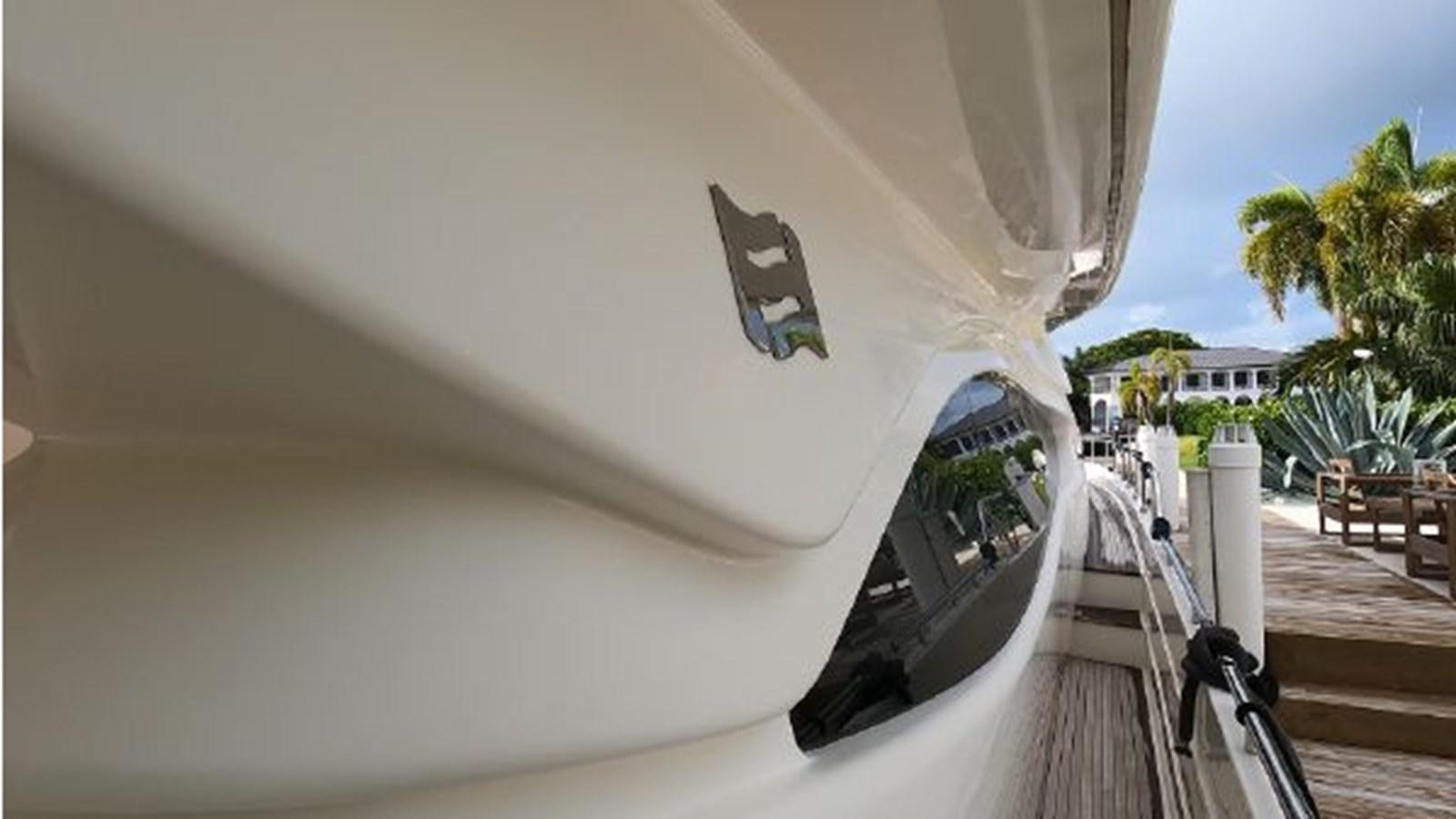 a white surfboard on a railing aboard 2005 760 FERRETTI MOTOR YACHT Yacht for Sale