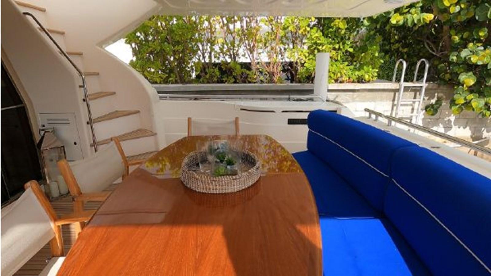 a table with a plate on it aboard 2005 760 FERRETTI MOTOR YACHT Yacht for Sale