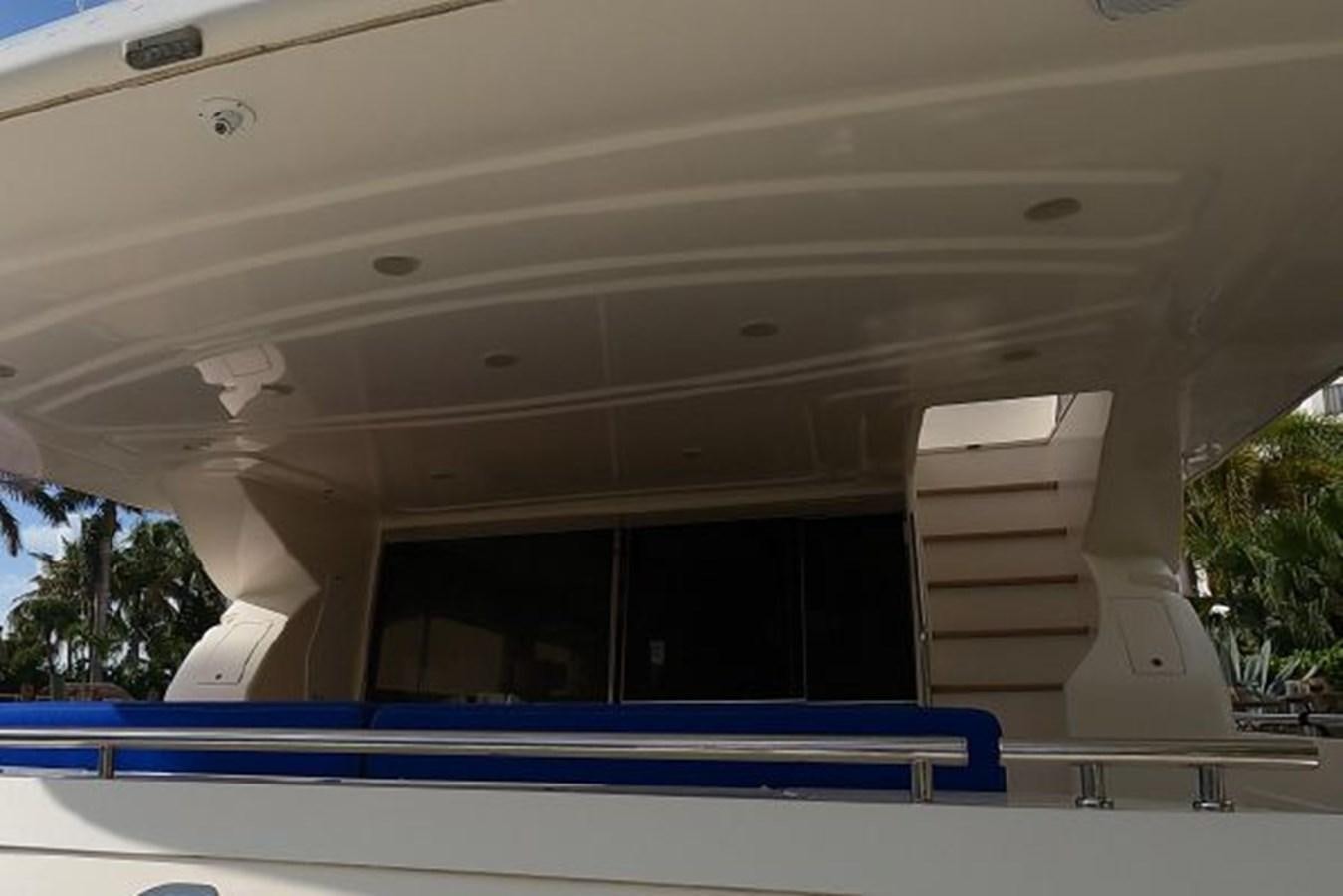 a white building with a blue railing aboard 2005 760 FERRETTI MOTOR YACHT Yacht for Sale