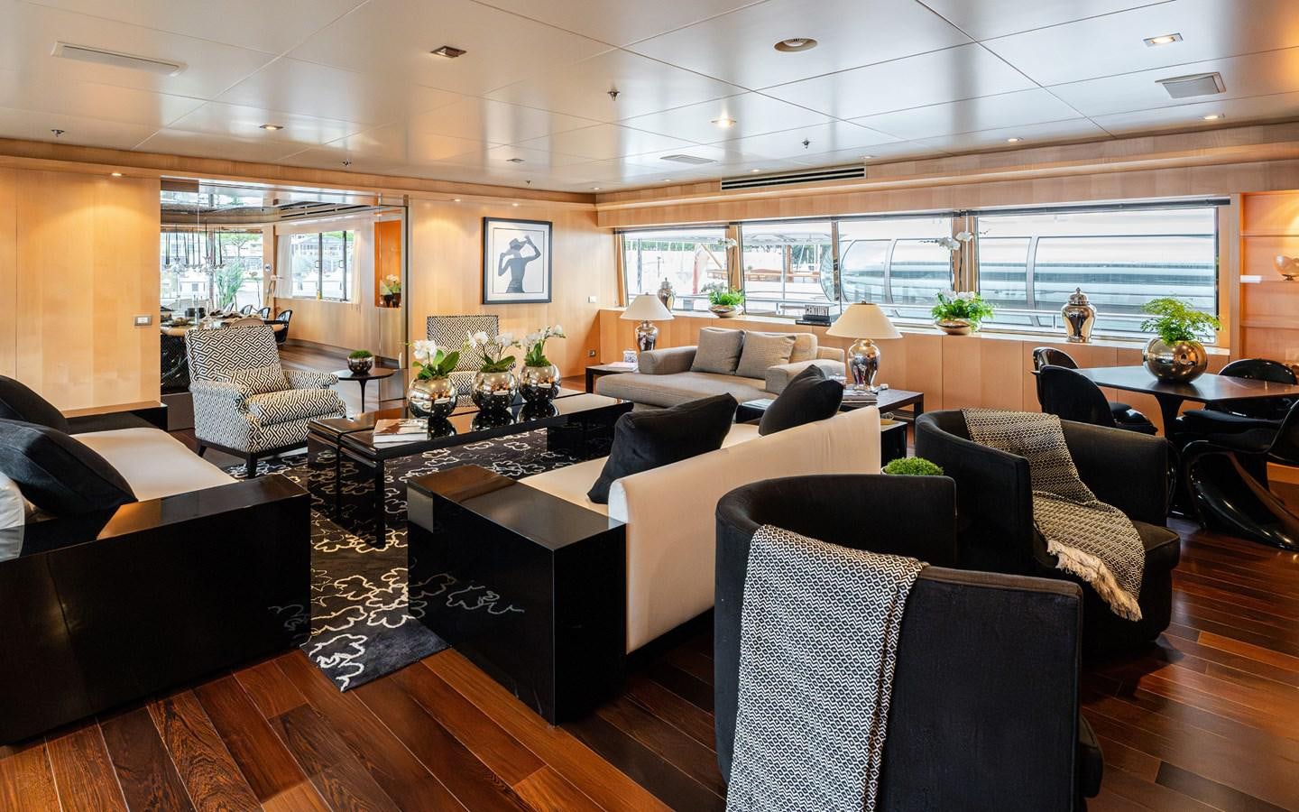 a living room with a large window aboard MONEIKOS Yacht for Sale