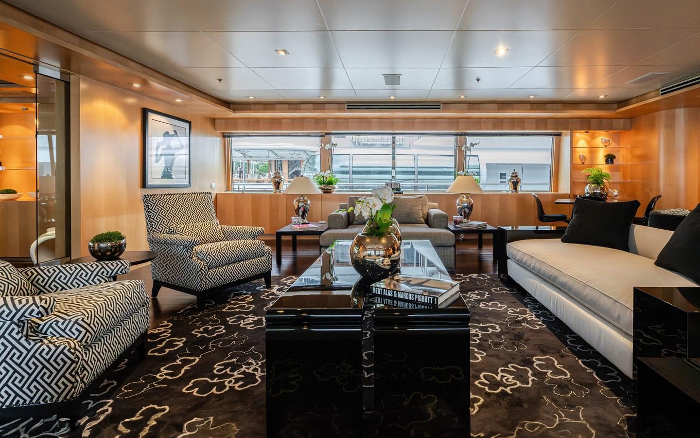 a living room with a large window aboard MONEIKOS Yacht for Sale