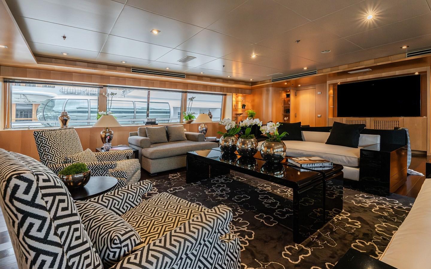 a living room with a large window aboard MONEIKOS Yacht for Sale