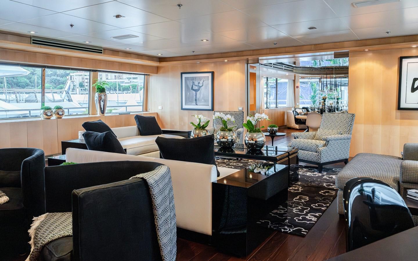 a living room with a large window aboard MONEIKOS Yacht for Sale