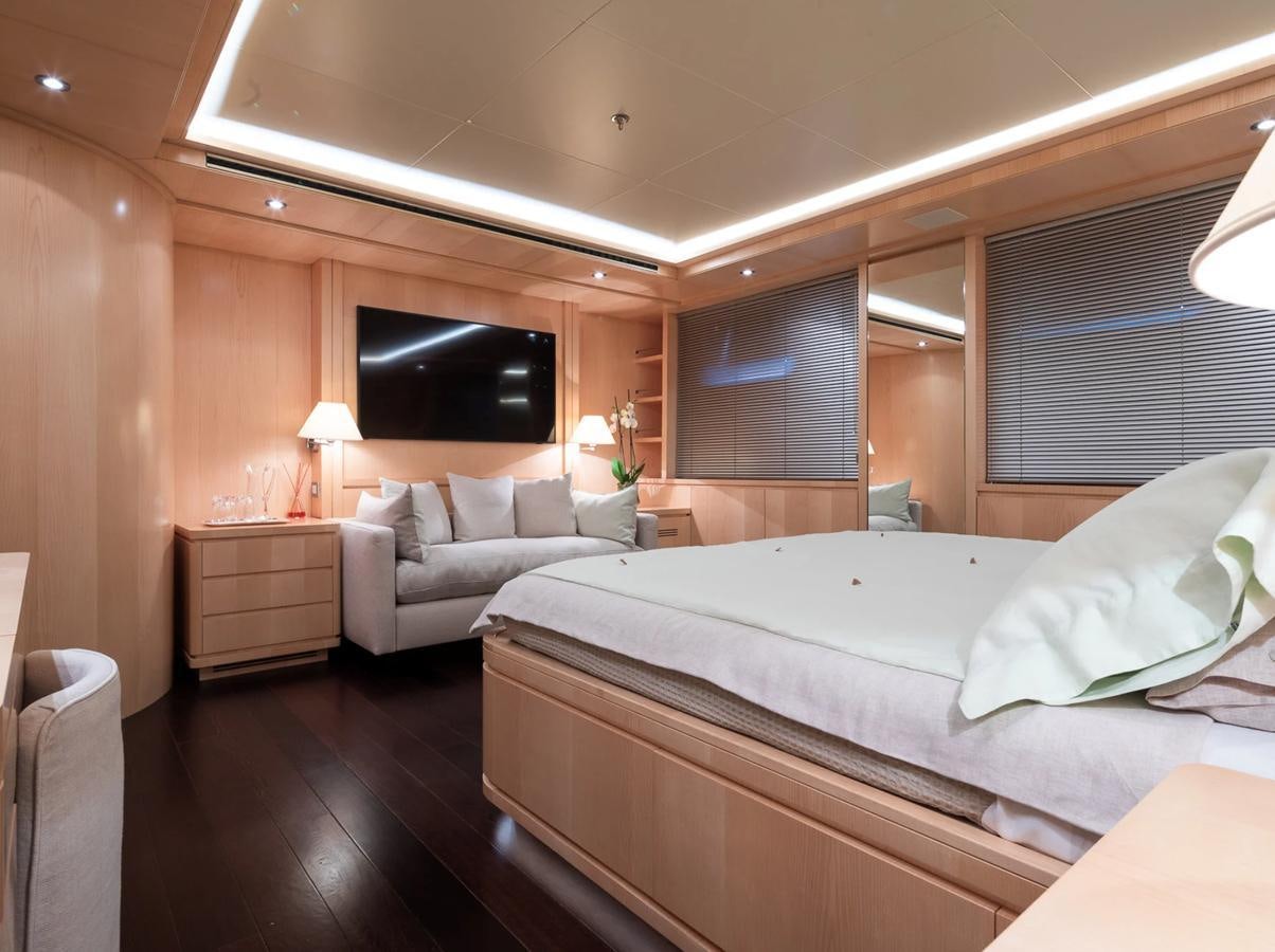 a hotel room with a bed and a tv aboard MONEIKOS Yacht for Sale