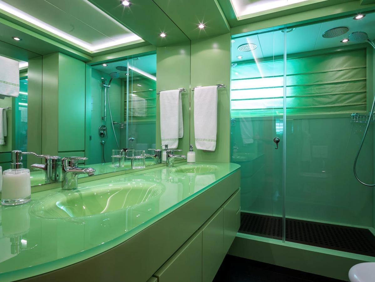 a bathroom with a glass shower aboard MONEIKOS Yacht for Sale