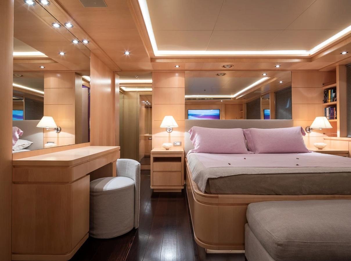 a hotel room with a bed and a desk aboard MONEIKOS Yacht for Sale